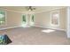 Large bonus room with plush carpeting, neutral walls, ceiling fan, and an abundance of natural light at 204 Shelton Dr, Mcdonough, GA 30252