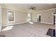 Spacious bonus room with plush carpeting, neutral walls, ceiling fan, and natural light at 204 Shelton Dr, Mcdonough, GA 30252