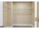Walk-in closet with wire shelving, carpeted floor and neutral-colored walls at 204 Shelton Dr, Mcdonough, GA 30252