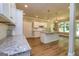 Open-concept kitchen featuring granite counters, ample cabinets, and eat-in island at 204 Shelton Dr, Mcdonough, GA 30252