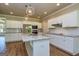 Stylish kitchen with stainless appliances, granite counters, and hardwood floors at 204 Shelton Dr, Mcdonough, GA 30252