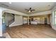 Spacious living room featuring hardwood flooring, a ceiling fan, and an open floor plan at 204 Shelton Dr, Mcdonough, GA 30252