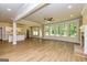 Bright living room with hardwood floors, large windows, and an open layout at 204 Shelton Dr, Mcdonough, GA 30252