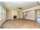 Large living room featuring hardwood floors, fireplace, and multiple windows at 204 Shelton Dr, Mcdonough, GA 30252