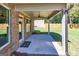 Covered patio with ceiling fan, concrete floor, and access to the backyard provides space for outdoor relaxation at 204 Shelton Dr, Mcdonough, GA 30252