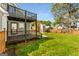 Expansive backyard featuring a covered patio and deck, perfect for outdoor entertaining and relaxation at 1471 Hardin Ave, College Park, GA 30337