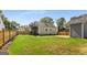 Lush backyard featuring a well-manicured lawn with a two-story deck, creating a serene outdoor retreat at 1471 Hardin Ave, College Park, GA 30337
