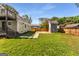 Lush backyard showcasing a storage shed and well-maintained lawn, providing ample space for outdoor activities at 1471 Hardin Ave, College Park, GA 30337