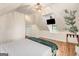 This bedroom features a vaulted ceiling, hardwood floors, a closet, and a tv at 1471 Hardin Ave, College Park, GA 30337