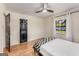 This bedroom has light walls, wood floors, and a decorative black door at 1471 Hardin Ave, College Park, GA 30337