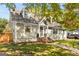 Charming home with shingle siding, dormer windows, and inviting brick steps at 1471 Hardin Ave, College Park, GA 30337