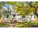 Charming home with shingle siding, brick steps, and mature trees at 1471 Hardin Ave, College Park, GA 30337