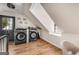 Bright laundry room featuring modern appliances, hardwood floors, and plenty of natural light at 1471 Hardin Ave, College Park, GA 30337