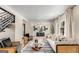 Bright and airy living room with modern decor, wood floors, and stylish seating at 1471 Hardin Ave, College Park, GA 30337