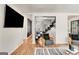 Bright living room with modern staircase, wood floors, and stylish furniture at 1471 Hardin Ave, College Park, GA 30337