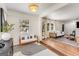 Bright and inviting living space with modern decor, wood floors, and a cozy atmosphere at 1471 Hardin Ave, College Park, GA 30337