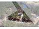Expansive property with home and pond surrounded by mature trees, highlighting the serene setting at 624 Bexley Rd, Moreland, GA 30259