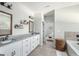 Bright bathroom features a soaking tub, double sinks, and natural light at 624 Bexley Rd, Moreland, GA 30259