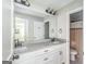 Bathroom with double vanity with granite counters and modern fixtures at 624 Bexley Rd, Moreland, GA 30259