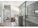 Bright bathroom features a soaking tub with stone surround and a glass-enclosed shower at 624 Bexley Rd, Moreland, GA 30259