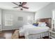 Inviting bedroom with natural light, hardwood floors, and ceiling fan at 624 Bexley Rd, Moreland, GA 30259