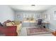 Bedroom with daybed, desk, and large window overlooking the wooded backyard at 624 Bexley Rd, Moreland, GA 30259