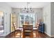 Dining room with a view, chandelier, and hardwood floors at 624 Bexley Rd, Moreland, GA 30259