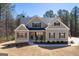 Well-maintained exterior showcasing the home's architectural details, including a mix of siding and stone accents at 624 Bexley Rd, Moreland, GA 30259