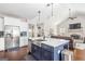 Open kitchen featuring a center island with a sink, with open views of the living room and fireplace at 624 Bexley Rd, Moreland, GA 30259
