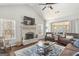 Comfortable living room with vaulted ceiling, stone fireplace, and ample seating; open and inviting space at 624 Bexley Rd, Moreland, GA 30259
