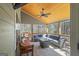 Large screened-in porch with seating for a crowd; perfect for entertaining at 624 Bexley Rd, Moreland, GA 30259