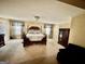 Bedroom with a four poster bed, carpeting, chandelier, and windows at 230 White Rd, Fayetteville, GA 30214