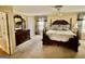 Comfortable bedroom with a bed, dresser and mirror combination, and ensuite doors at 230 White Rd, Fayetteville, GA 30214