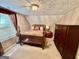 Bedroom with carpet, wooden four-poster bed and dresser, and natural light from window at 230 White Rd, Fayetteville, GA 30214
