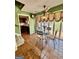 Cozy dining area with tiled floors and windows, adjacent to kitchen and stairs at 230 White Rd, Fayetteville, GA 30214
