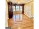 Classic dining room featuring hardwood floors, wainscoting, and large windows for natural light at 230 White Rd, Fayetteville, GA 30214