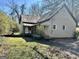 Quaint exterior of home featuring metal roof and inviting front porch at 230 White Rd, Fayetteville, GA 30214