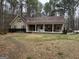 Spacious ranch style home with a welcoming front porch, situated on a large, well-maintained front yard at 230 White Rd, Fayetteville, GA 30214