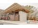 A modern brick commercial building with outdoor seating at 230 White Rd, Fayetteville, GA 30214