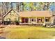 Charming ranch-style home with inviting front porch and well-manicured lawn at 230 White Rd, Fayetteville, GA 30214