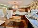 Functional kitchen featuring tiled floors, ample cabinet space, and classic appliances at 230 White Rd, Fayetteville, GA 30214