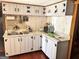Functional kitchen featuring white cabinets and stainless steel appliances, perfect for everyday cooking at 230 White Rd, Fayetteville, GA 30214