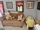 Living room with comfy couch and pillows, creating a cozy and inviting atmosphere at 230 White Rd, Fayetteville, GA 30214