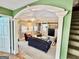 Inviting living room featuring an archway, fireplace, and built-in shelving for storage and decor at 230 White Rd, Fayetteville, GA 30214