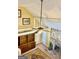 Bright living room boasting a stone fireplace, vaulted ceiling, and wooden built-in shelving at 230 White Rd, Fayetteville, GA 30214