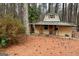 Charming outbuilding featuring a green roof, wooden siding, and a cozy front porch at 230 White Rd, Fayetteville, GA 30214