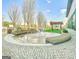 A picturesque outdoor fountain is surrounded by lush landscaping and a pleasant seating area at 230 White Rd, Fayetteville, GA 30214