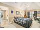 Bedroom featuring vaulted ceilings, carpeted floors, and an adjoining bath at 1209 Persimmon Way, Mcdonough, GA 30252