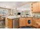 Kitchen area with stainless steel dishwasher, granite countertops, and wood floors at 1209 Persimmon Way, Mcdonough, GA 30252