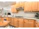 This kitchen features stainless steel appliances, granite countertops, and a gas range at 1209 Persimmon Way, Mcdonough, GA 30252